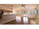 Open floor plan featuring living and kitchen area with tile and wood floors at 6016 Bungalow Bay St, Las Vegas, NV 89130