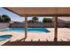Covered patio view of backyard featuring pool and hot tub at 6016 Bungalow Bay St, Las Vegas, NV 89130