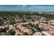 Aerial shot of a neighborhood showcasing meticulously maintained streets, and desert landscaping at 613 Cervantes Dr, Henderson, NV 89014