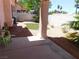 Backyard space with desert landscaping, brick perimeter wall and green decorative turf at 613 Cervantes Dr, Henderson, NV 89014