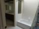 Tiled bathroom featuring a tub and vanity at 613 Cervantes Dr, Henderson, NV 89014