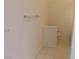 Tiled bathroom with towel rack and toilet at 613 Cervantes Dr, Henderson, NV 89014
