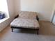Bedroom with floral couch and bright window at 613 Cervantes Dr, Henderson, NV 89014