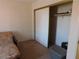 This bedroom features neutral paint, carpet and a sliding-door closet for ample storage space at 613 Cervantes Dr, Henderson, NV 89014