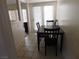 Cozy dining area features a dark table set near sliding glass doors for natural light at 613 Cervantes Dr, Henderson, NV 89014