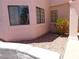 Exterior view featuring desert landscaping and well-maintained siding, complemented by dark-framed windows at 613 Cervantes Dr, Henderson, NV 89014