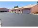 Exterior view showcasing attached garages and desert landscaping, adding to the property's curb appeal at 613 Cervantes Dr, Henderson, NV 89014