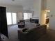 Spacious living room featuring large windows, fireplace and comfortable seating at 613 Cervantes Dr, Henderson, NV 89014