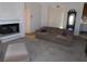 Inviting living room with a cozy fireplace and comfortable seating arrangement at 613 Cervantes Dr, Henderson, NV 89014