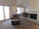 Open-concept living area with fireplace, large windows, and dining area at 613 Cervantes Dr, Henderson, NV 89014