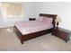 Main bedroom with a comfortable bed, side tables, and soft natural light at 613 Cervantes Dr, Henderson, NV 89014