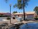 Picturesque street view with mature trees, desert landscaping, and well-maintained home exteriors at 613 Cervantes Dr, Henderson, NV 89014