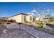 Beautiful backyard landscaping featuring a brick walkway and manicured garden at 6333 Orto Vaso Ave, Las Vegas, NV 89131