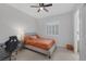Bedroom featuring neutral walls, a comfortable bed, and a desk area with a gaming chair at 6333 Orto Vaso Ave, Las Vegas, NV 89131