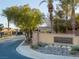 Neighborhood entrance to Hidden Canyon Estates with desert landscaping and guard house at 6333 Orto Vaso Ave, Las Vegas, NV 89131