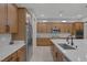 Spacious kitchen with stainless steel appliances, granite countertops, and ample cabinet space at 6333 Orto Vaso Ave, Las Vegas, NV 89131