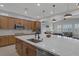 Bright kitchen with a large island, stainless appliances, and granite countertops at 6333 Orto Vaso Ave, Las Vegas, NV 89131