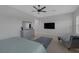 The main bedroom has a wall-mounted TV, chase lounge, and plantation shutters at 6333 Orto Vaso Ave, Las Vegas, NV 89131