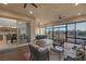 Covered patio with an outdoor kitchen, seating area, and sliding glass doors to indoor living space at 6333 Orto Vaso Ave, Las Vegas, NV 89131