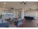 Spacious covered patio with ceiling fans, outdoor seating, and access to the backyard at 6333 Orto Vaso Ave, Las Vegas, NV 89131