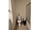 Bathroom featuring a toilet and a shower with glass doors at 6361 Copperfield Ave, Las Vegas, NV 89108