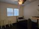 Cozy bedroom featuring a ceiling fan, natural light and simple decor at 6361 Copperfield Ave, Las Vegas, NV 89108