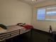 Bedroom with minimalist decor, a simple bed frame, and a window at 6361 Copperfield Ave, Las Vegas, NV 89108