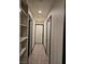Hallway with tiled floor and built-in storage at 6361 Copperfield Ave, Las Vegas, NV 89108