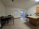 Spacious kitchen with seating at granite island, stainless appliances, and tiled flooring at 6361 Copperfield Ave, Las Vegas, NV 89108