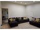 Open-concept living room with tiled floors and ample seating for entertaining at 6361 Copperfield Ave, Las Vegas, NV 89108