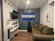 Comfortable couch located in living room with wall mounted television at 6361 Copperfield Ave, Las Vegas, NV 89108