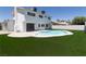 Backyard featuring a manicured lawn and a private pool at 637 Otono Dr, Boulder City, NV 89005