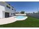 Spacious backyard with a well-maintained lawn and private pool at 637 Otono Dr, Boulder City, NV 89005