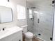 Stylish bathroom featuring tiled shower, white marble counters, and modern fixtures at 637 Otono Dr, Boulder City, NV 89005