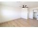 Spacious bedroom with light wood flooring and ceiling fan at 637 Otono Dr, Boulder City, NV 89005