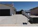 Wide driveway leading to the house and a black garage door at 637 Otono Dr, Boulder City, NV 89005
