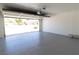 Spacious garage with epoxy floors and an open door to the outdoors at 637 Otono Dr, Boulder City, NV 89005