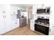 Well-equipped kitchen featuring stainless steel appliances and white cabinetry for a modern feel at 637 Otono Dr, Boulder City, NV 89005