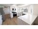 Stylish kitchen featuring stainless steel appliances, white countertops, and hardwood floors at 637 Otono Dr, Boulder City, NV 89005