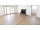 Inviting living room featuring hardwood floors, a cozy fireplace, and natural light at 637 Otono Dr, Boulder City, NV 89005