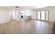 Open-concept living space with hardwood floors, a kitchen view, and French doors to the backyard at 637 Otono Dr, Boulder City, NV 89005