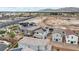 This aerial shot showcasing the house with mountain views, solar panels and desert landscaping at 6611 Dove Point Pl, Las Vegas, NV 89130
