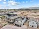 An aerial view showcasing the house with solar panels, desert landscaping and outdoor living at 6611 Dove Point Pl, Las Vegas, NV 89130