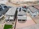 Aerial shot displaying the house with solar panels, desert landscaping and an outdoor living area at 6611 Dove Point Pl, Las Vegas, NV 89130