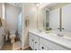 Elegant bathroom featuring double sinks, a large mirror, and modern fixtures at 6611 Dove Point Pl, Las Vegas, NV 89130