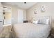 Cozy bedroom boasts a comfortable bed, soft lighting, and inviting decor at 6611 Dove Point Pl, Las Vegas, NV 89130