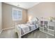 Bright bedroom featuring neutral tones, a comfortable bed, and ample natural light at 6611 Dove Point Pl, Las Vegas, NV 89130