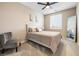 Charming bedroom featuring neutral tones, a plush bed, and ample natural light at 6611 Dove Point Pl, Las Vegas, NV 89130