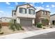 Charming two-story home with a two-car garage and beautiful landscaping at 6611 Dove Point Pl, Las Vegas, NV 89130