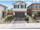 Charming two-story home featuring a two-car garage and attractive exterior at 6611 Dove Point Pl, Las Vegas, NV 89130
